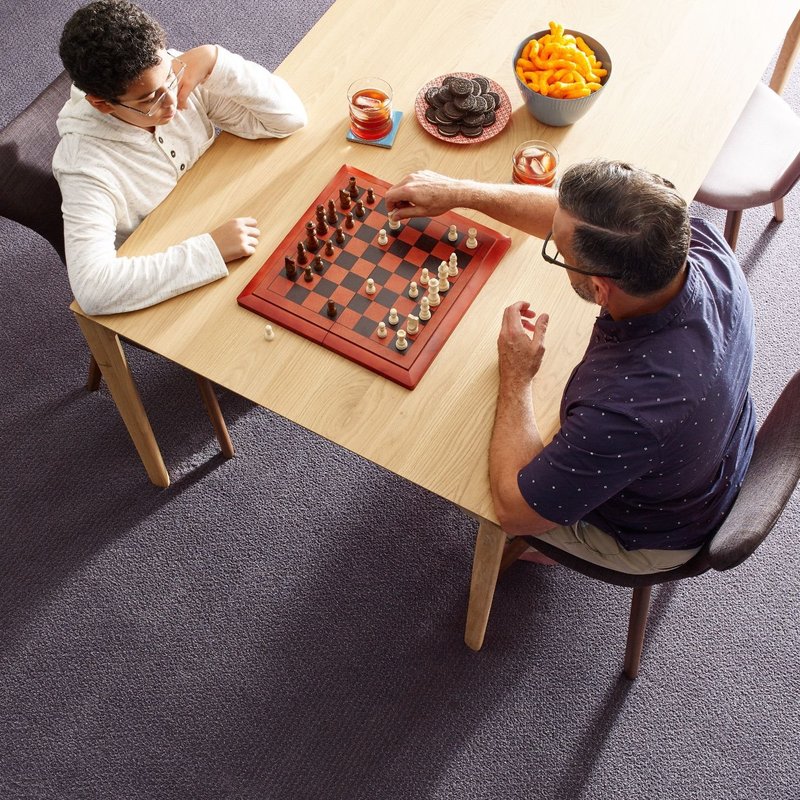 Men playing chess - Mike's Floors in Sitka, AK